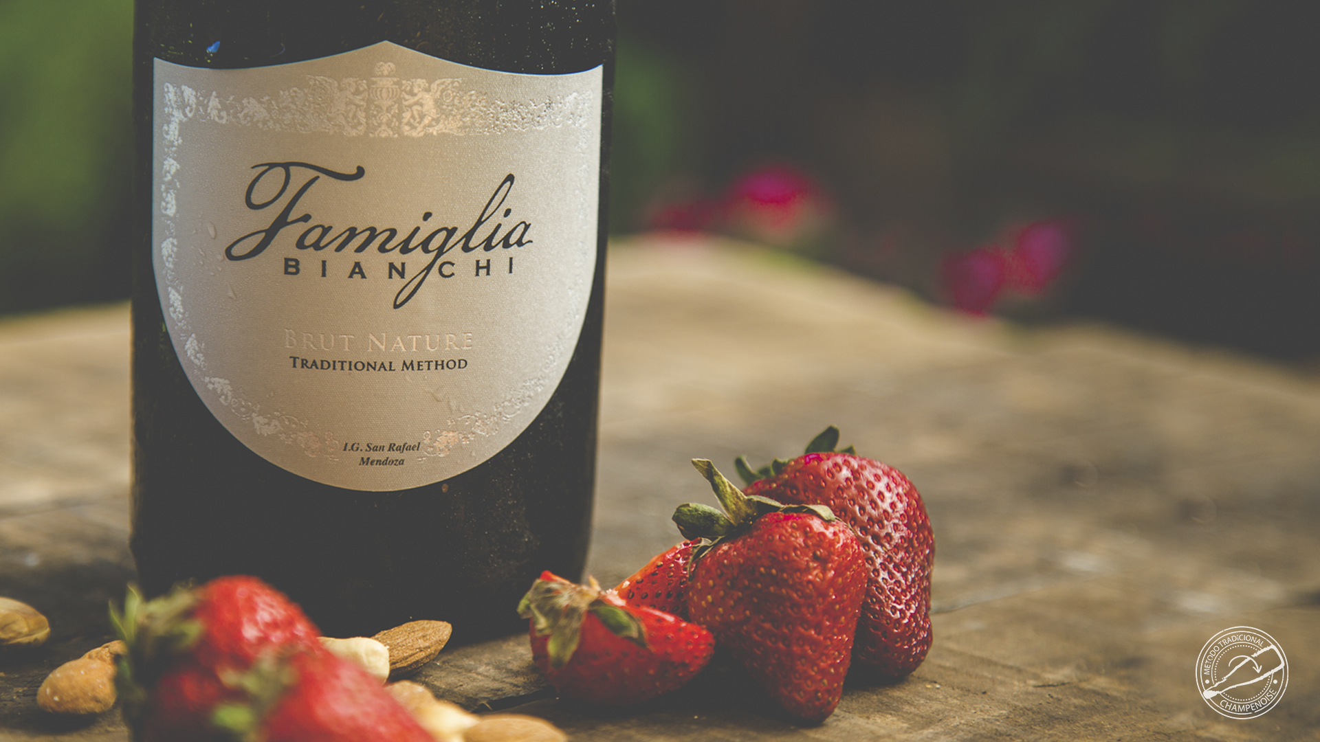 Famiglia Brut Nature bottle with strawberries