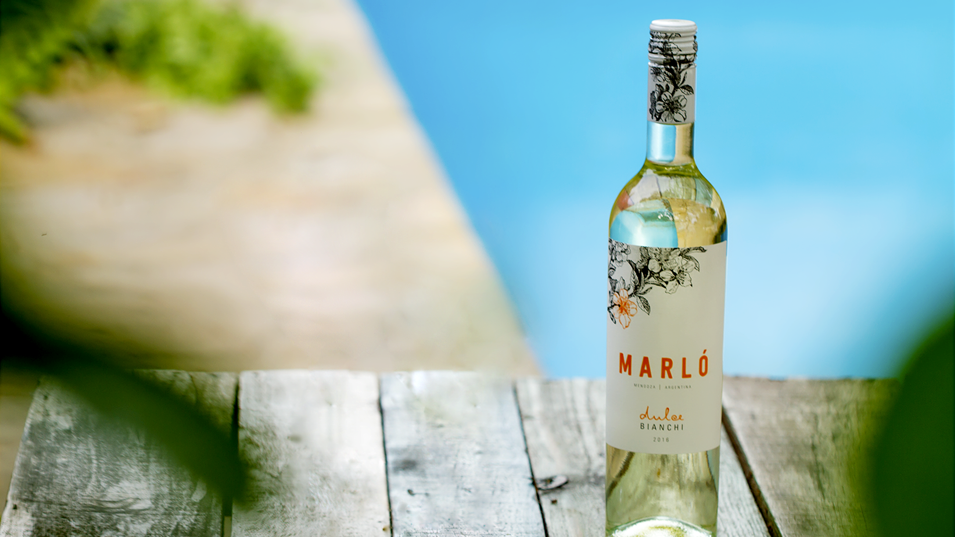 Marló sweet bottle over wooden background
